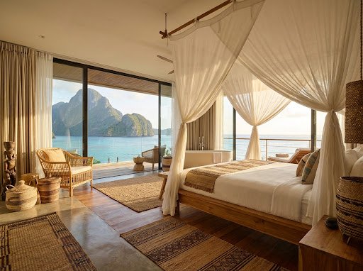 Ocean pavilion bedroom overlooking El Nido limestone cliffs